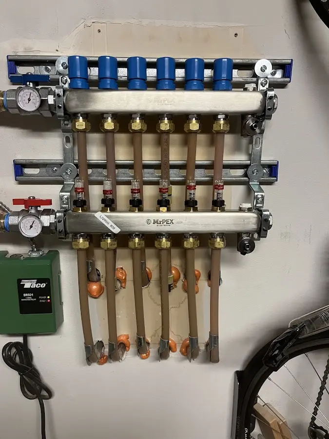 Plumber performing Gas Line Installation at a residential property in Hampstead